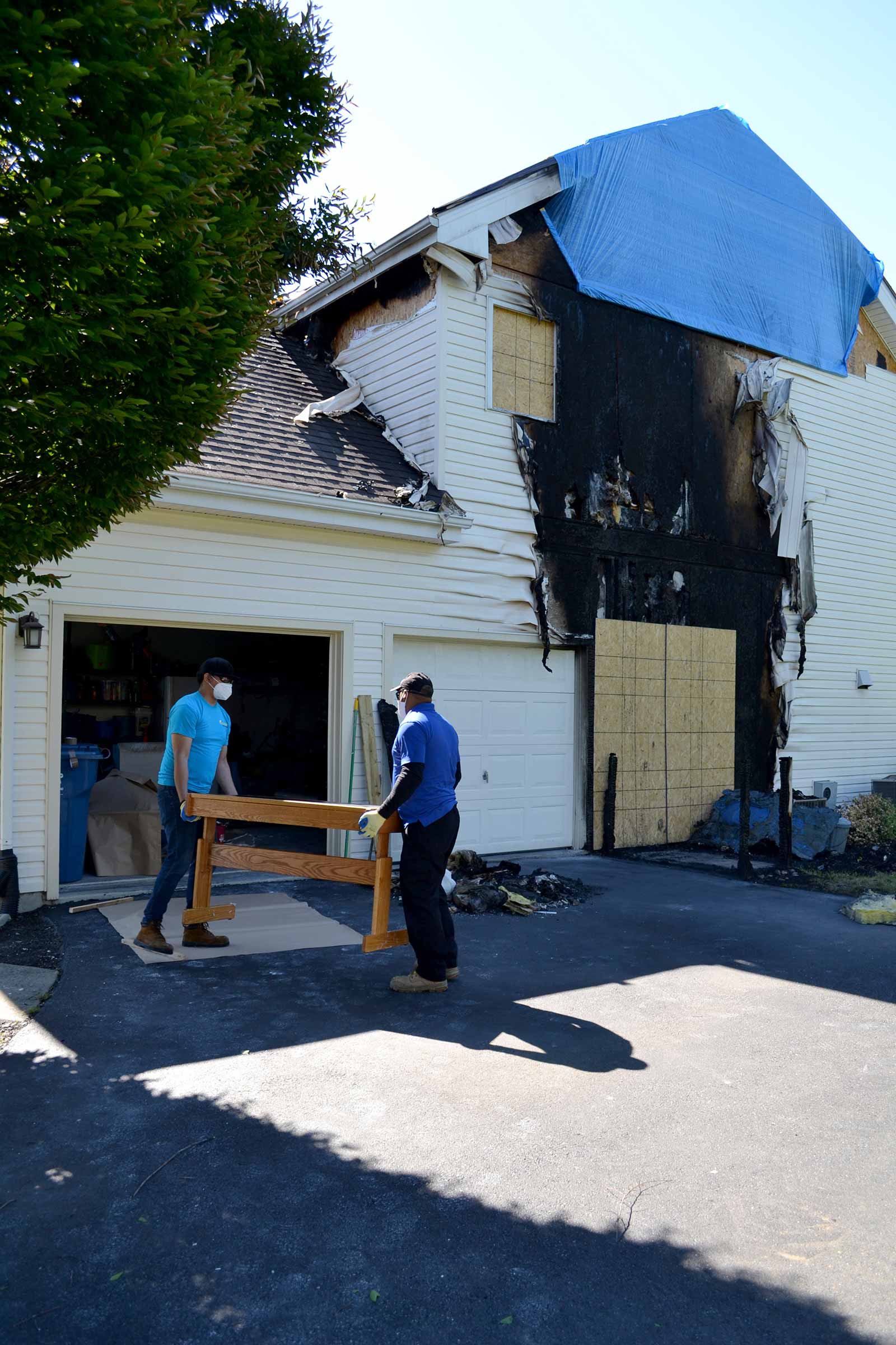 Blue Kangaroo Packoutz contents packout franchise two men remove contents from burned house