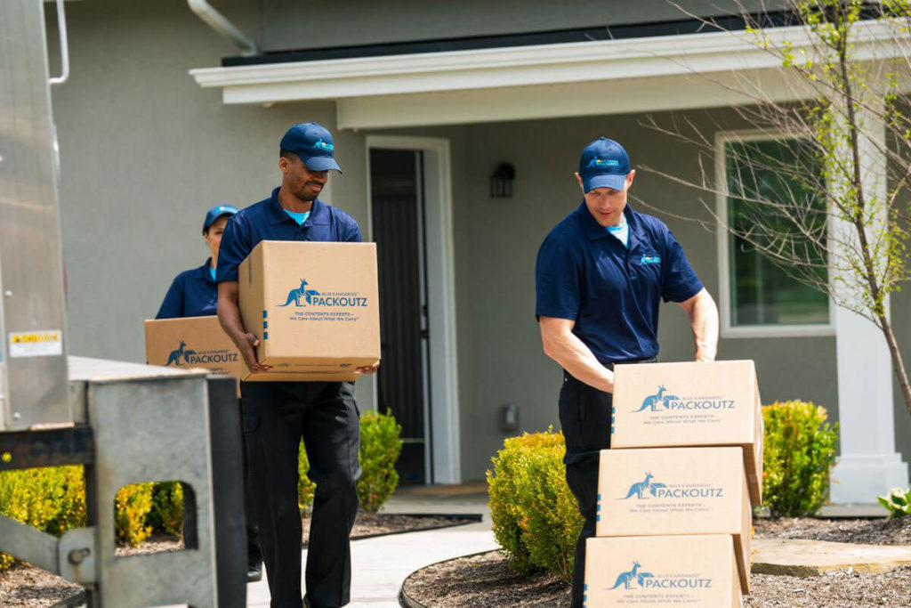 Blue Kangaroo Packoutz franchise employees take boxes out of house